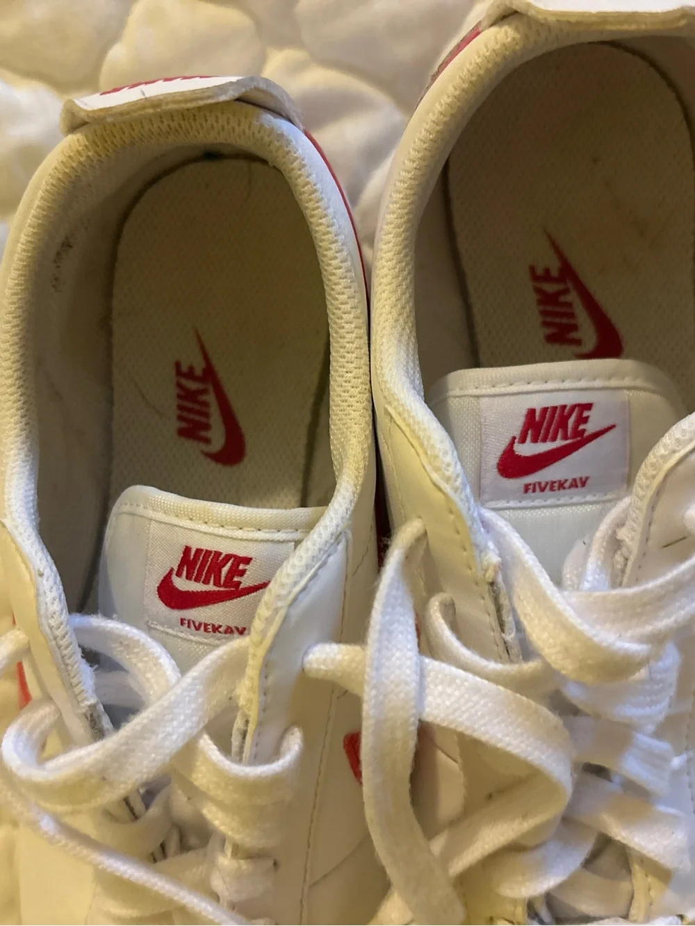 Nike White Sneakers with Pink Swoosh Accents